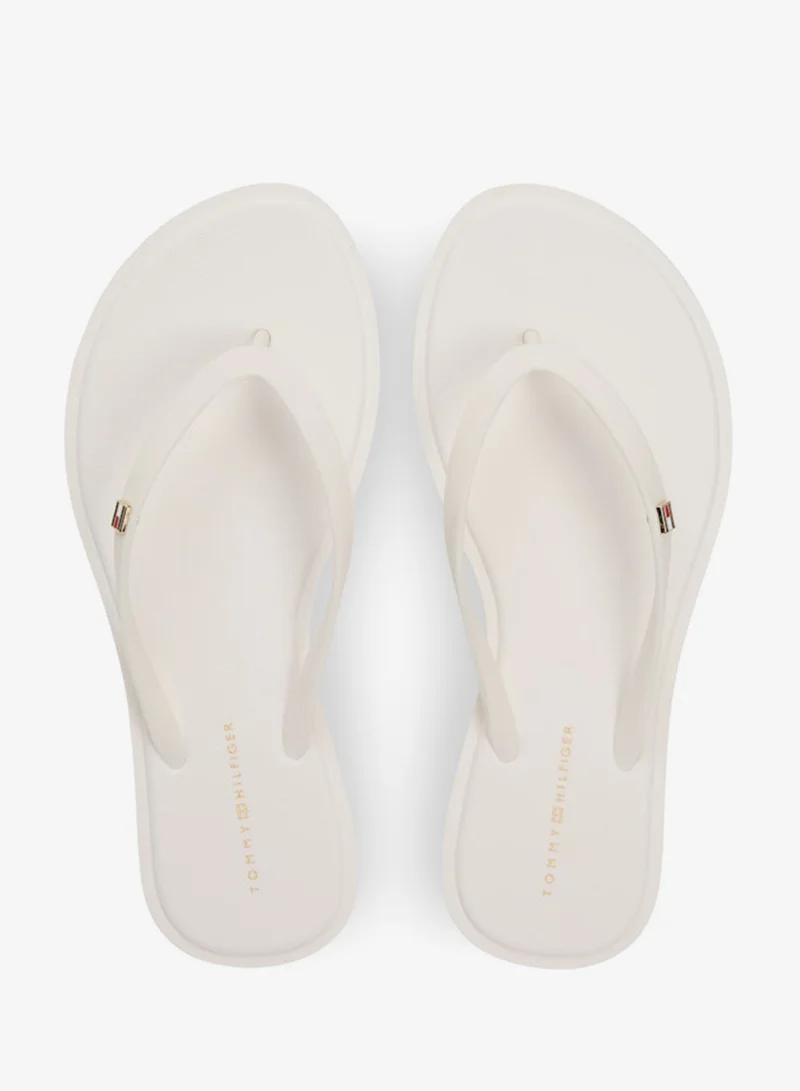 TOMMY HILFIGER  Chic Enamel Flag Flip-Flops for Women | Best Price UAE